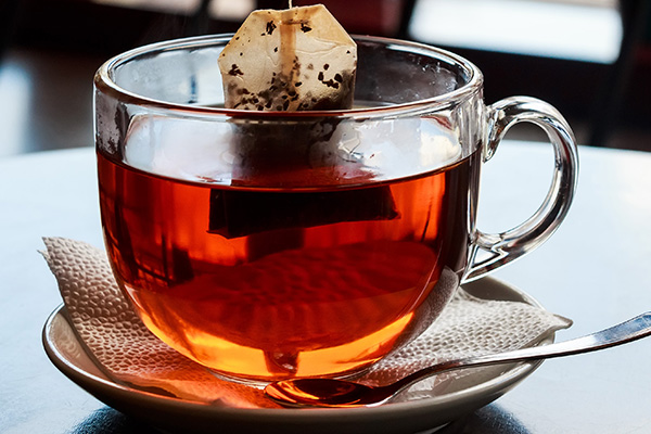 Tea bag put in transparent glass teacup