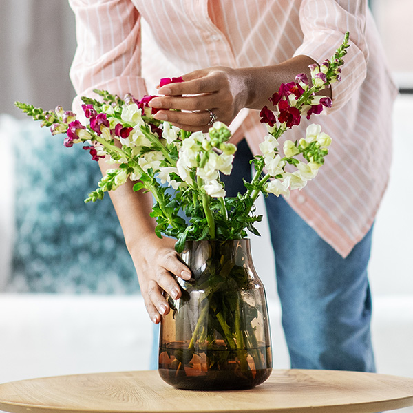 woman cleaning flowers