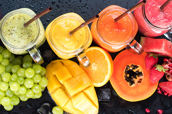 Fresh Color Juices Smoothie Violet Green Yellow Orange Red from Tropical Fruits