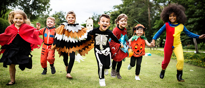 kids wearing halloween costumes
